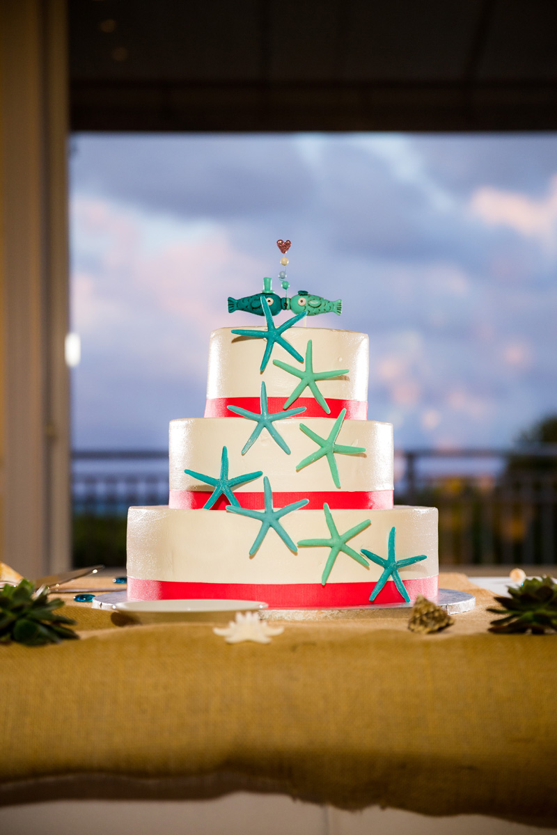 Elegant White Wedding Cake with Chocolate Starfish and Fish Cake Topper | The Majestic Vision Wedding Planning | Palm Beach Shores Community Center in Palm Beach, FL | www.themajesticvision.com | Chris Kruger Photography