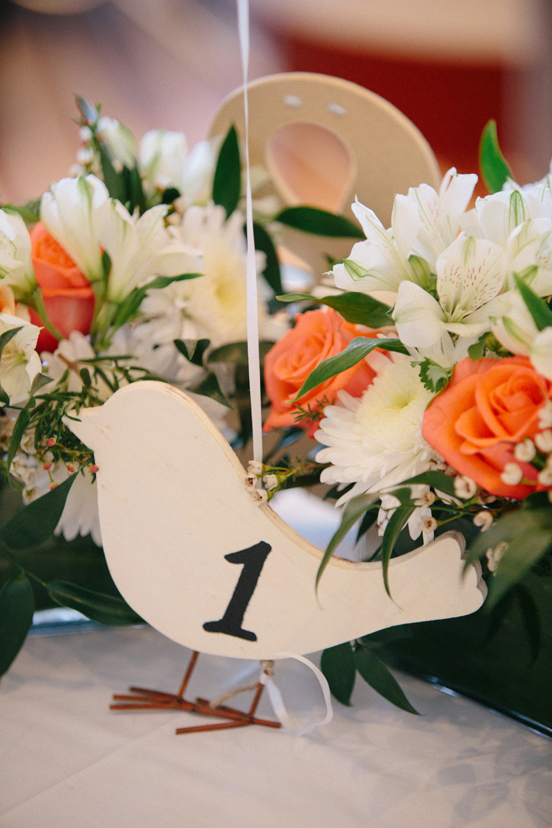 Modern Centerpieces with White Roses and Orange Roses and Bird Table Number | The Majestic Vision Wedding Planning | Marriott Singer Island in Palm Beach, FL | www.themajesticvision.com | Robert Madrid Photography