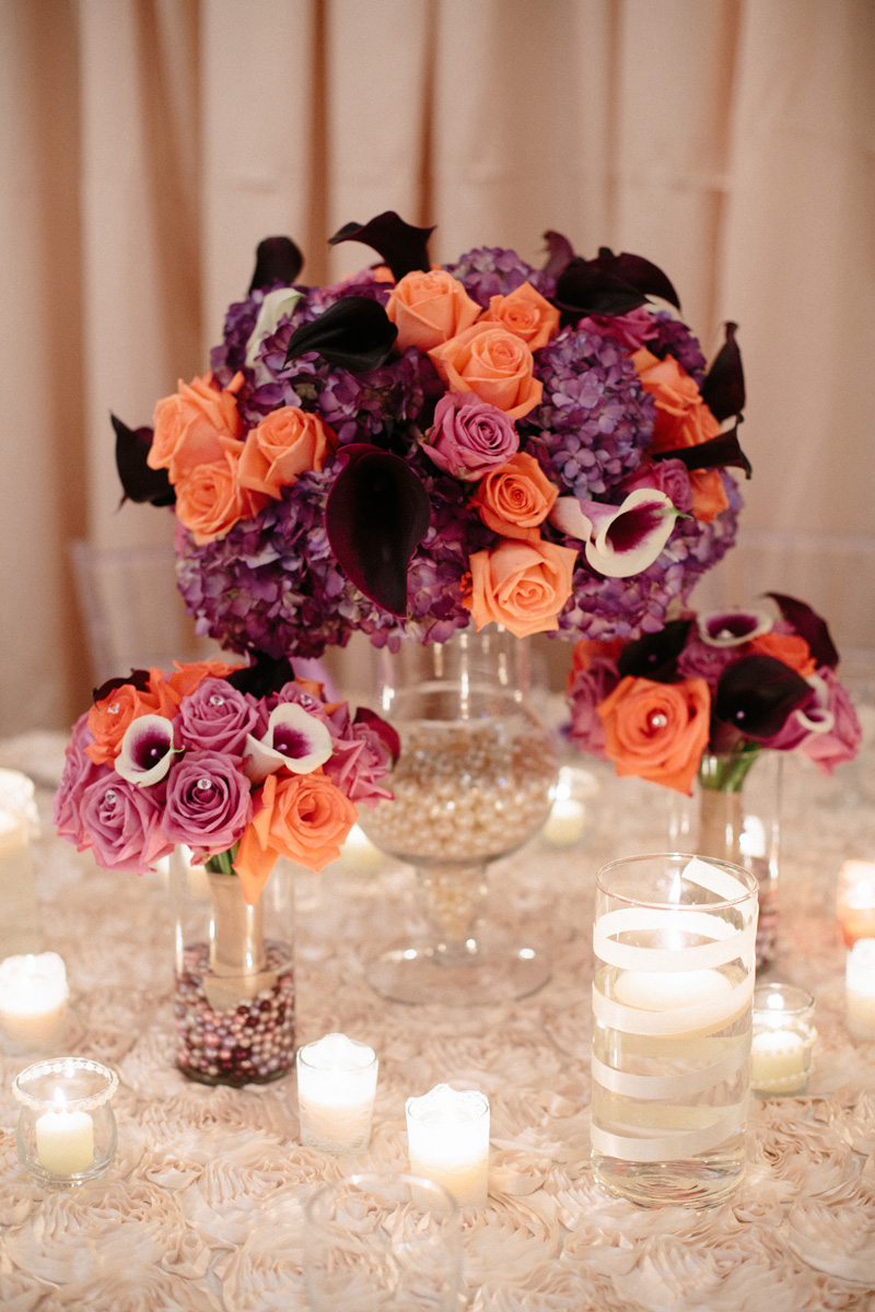 Elegant Centerpiece with Purple Roses, Coral Roses and Calla Lillies | The Majestic Vision Wedding Planning | Sailfish Marina in Palm Beach, FL | www.themajesticvision.com | Robert Madrid Photography