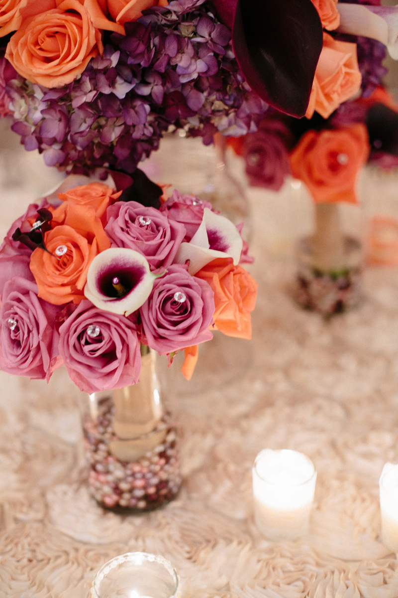 Elegant Centerpiece with Purple Roses, Coral Roses and Calla Lillies | The Majestic Vision Wedding Planning | Sailfish Marina in Palm Beach, FL | www.themajesticvision.com | Robert Madrid Photography