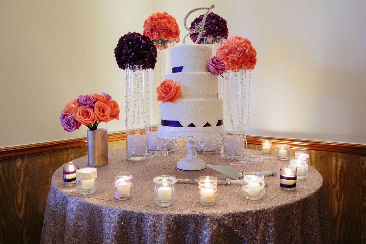 Elegant Wedding Cake with Purple Roses and Coral Roses | The Majestic Vision Wedding Planning | Sailfish Marina in Palm Beach, FL | www.themajesticvision.com | Robert Madrid Photography
