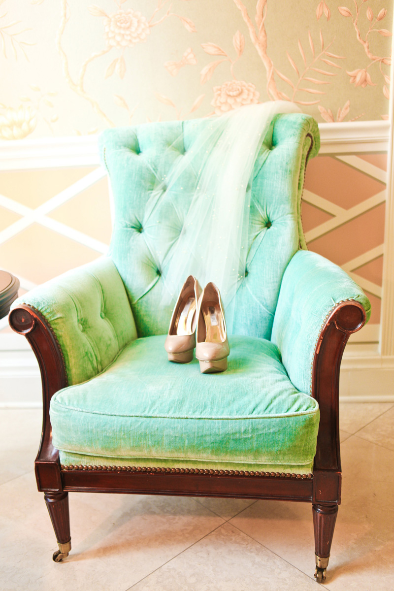 Elegant Gold Shoes and Veil on Aqua Armchair | The Majestic Vision Wedding Planning | The Colony Hotel in Palm Beach, FL | www.themajesticvision.com | Krystal Zaskey Photography