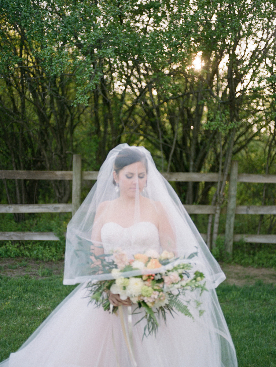 Beautiful Bride in Blush Tara Keely Gown Carrying Elegant Bridal Bouquet with Cream, Blush and Pink Flowers | The Majestic Vision Wedding Planning | Rustic Manor in Milwaukee, WI | www.themajesticvision.com | Elizabeth Haase Photography