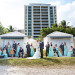 Whimsical Wedding Party Blowing Kisses at Grand Bay Club in Key Biscayne, FL thumbnail